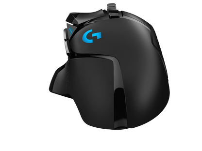 Logitech G502 HERO RGB Gaming Mouse in a high-performance gaming setup with RGB lighting keyboard and monitor.